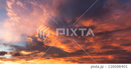 Dramatic vibrant sunrise or sunset sky and cloud Dramatic vibrant sunrise or sunset sky and cloud 116086401