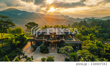 aerial view of a modern luxury house Thai style wooden mountain view in country and beautiful clouds and sunrise aerial view of a modern luxury house Thai style wooden mountain view in country and beautiful clouds and sunrise 116087161