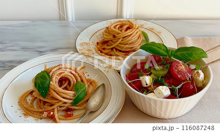 Simple Tomato and Basil Pasta With a Side Salad 116087248