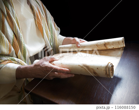 Man's hans holding a scroll 116088150