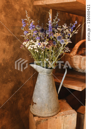 bouquet of dried flowers in a vintage vase 116088421