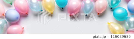 Bright Colorful Helium Balloons in a Row Against White Wall - Party and Celebration Concept 116089689