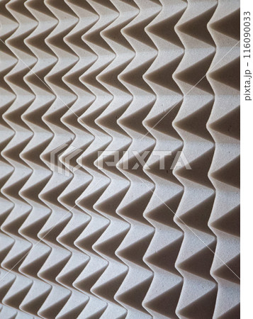 Grey Acoustic Foam. Close-up of sound-absorbing foam with pyramid shapes. 116090033