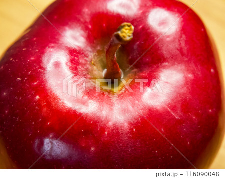 Juicy Apple Freshness. A juicy red apple with visible water droplets. 116090048