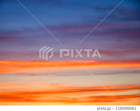 A tranquil evening sky showcasing a gradient of colors; a backdrop for meditation or mindfulness practices. 116090062