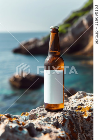 Serene Beachside With Single Beer Bottle on Rocky Shore Serene Beachside With Single Beer Bottle on Rocky Shore 116090163