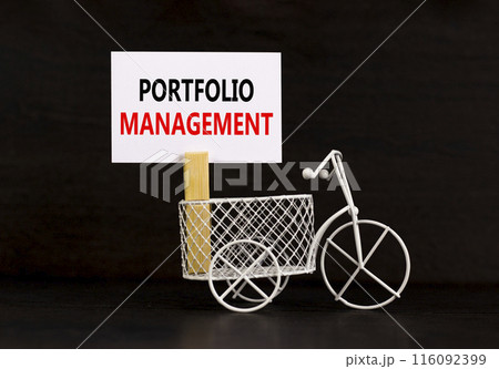 Portfolio management symbol. Concept words Portfolio management on beautiful white paper on clothespin. Beautiful black background. Bike model. Business Portfolio management concept. Copy space. Portfolio management symbol. Concept words Portfolio management on beautiful white paper on clothespin. Beautiful black background. Bike model. Business Portfolio management concept. Copy space. 116092399