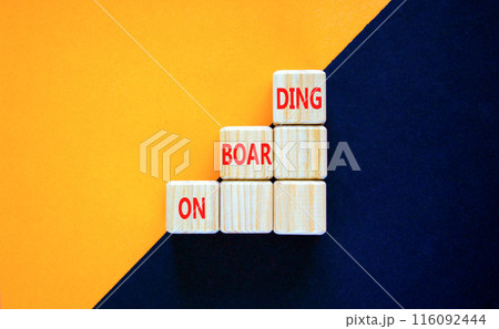 Onboarding success symbol. Concept word Onboarding on beautiful wooden cubes. Beautiful orange black background. Business onboarding success concept. Copy space. 116092444