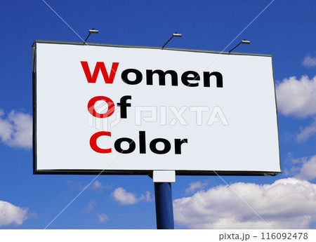 WOC women of color symbol. Concept words WOC women of color on beautiful big billboard. Beautiful blue sky cloud background. Business WOC women of color social issues concept. Copy space. 116092478
