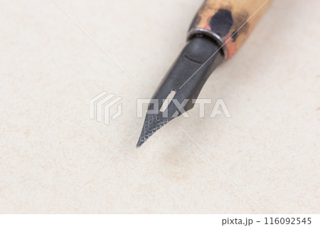 Fountain pen on an antique textured paper. 116092545