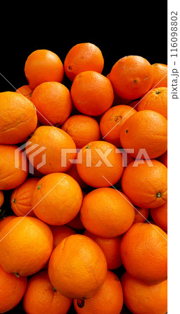 Lots of oranges on rack. Tasty and juicy. Background of oranges. arrange neatly grocery store, fruit market, supermarket 116098802