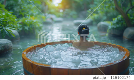 Woman in Ice Bath Near River Spa 116103174