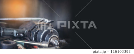 Banner Mechanic tools engineering equipment car auto repair shop with copy space. Blurred background mechanical service. Banner Heavy screw grungy rusted dirty object black background with copy space Banner Mechanic tools engineering equipment car auto repair shop with copy space. Blurred background mechanical service. Banner Heavy screw grungy rusted dirty object black background with copy space 116103392