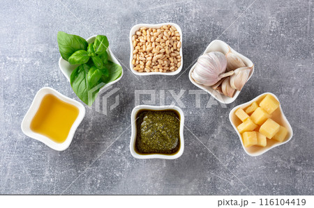 Traditional Italian pesto recipe on a grey stone background. 116104419