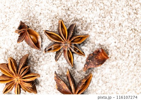 Spice star anise closeup on gray stone background 116107274