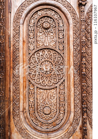 oriental Islamic pattern Uzbek arabesque ornament on wooden carved door in Tashkent in Uzbekistan close up oriental Islamic pattern Uzbek arabesque ornament on wooden carved door in Tashkent in Uzbekistan close up 116107967