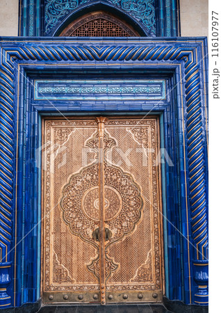 Wooden door with carved oriental pattern Uzbek ornament in Museum of Victims of Political Repression in Tashkent Wooden door with carved oriental pattern Uzbek ornament in Museum of Victims of Political Repression in Tashkent 116107977
