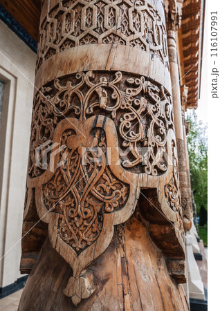 carved wooden column with oriental pattern Uzbek ornament in Uzbekistan in Tashkent 116107991