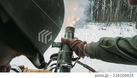 Mortar Shooting Explosions Forest. Close-up View On Re-enactors Dressed As American Infantry Soldiers Fire From Mortar. Usa Army Soldiers Of World War Ii. Reconstruction Defense Battles. Heroes Of War Mortar Shooting Explosions Forest. Close-up View On Re-enactors Dressed As American Infantry Soldiers Fire From Mortar. Usa Army Soldiers Of World War Ii. Reconstruction Defense Battles. Heroes Of War 116108024