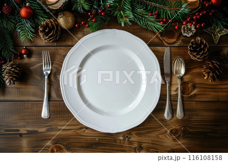 Festive Christmas Table Setting with Empty White Plate and Holiday Decorations 116108158