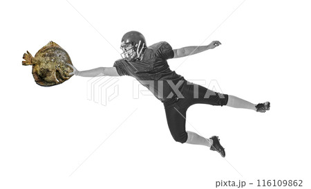 Black and white image of American football player catching large fish instead of a football ball. Contemporary art collage. 116109862