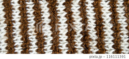 Handmade knitted fabric brown and white wool background texture 116111391