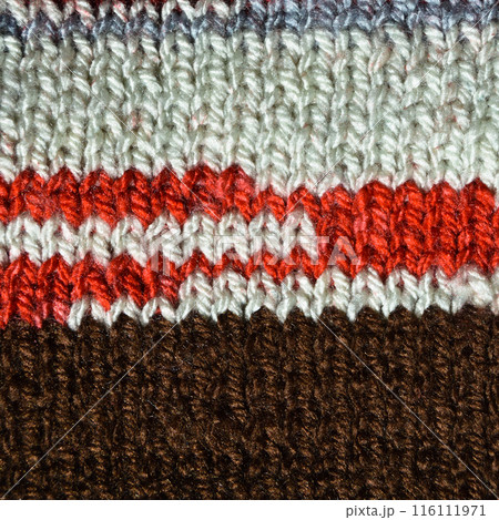 Handmade knitted fabric brown red and beige wool background texture 116111971