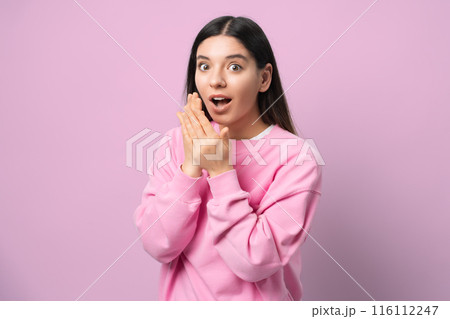 Whoa, didn't see that coming. Young woman in pink, eyes wide and jaw dropped, serving pure surprise vibes. Perfect for capturing those unexpected, OMG moments Whoa, didn't see that coming. Young woman in pink, eyes wide and jaw dropped, serving pure surprise vibes. Perfect for capturing those unexpected, OMG moments 116112247