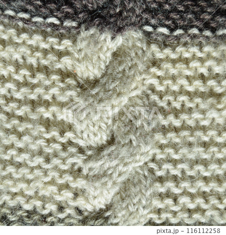 Handmade knitted fabric grey and white wool background texture Handmade knitted fabric grey and white wool background texture 116112258