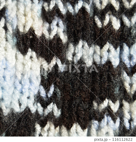 Handmade knitted fabric white and black wool background texture 116112622