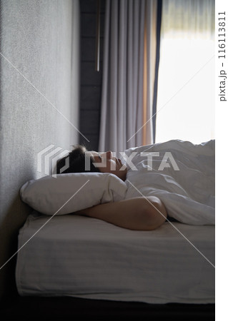 Woman Sleeping Peacefully in Bed 116113811