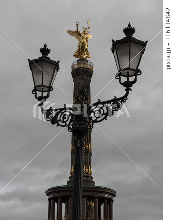 The victory column with historical street lamp in foreground. 116114842