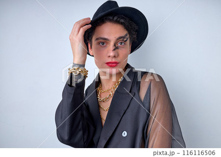 Portrait of emotive gender 20s transgender gay man wearing necklace, isolated on white Portrait of emotive gender 20s transgender gay man wearing necklace, isolated on white 116116506
