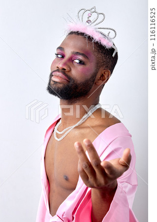 Awesome black half-naked man in crown posing at camera like a fairy, princess Awesome black half-naked man in crown posing at camera like a fairy, princess 116116525