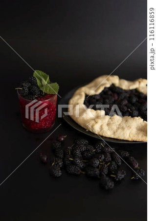 A galette pie with mulberry and  multivitamin smoothie with a mulberry, raspberry, gooseberry, currant, mint, orange, gooseberry 116116859