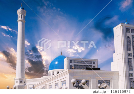 white minaret and blue dome of marble Islamic Masjid Minor Mosque in Tashkent in Uzbekistan on background of sunrise sky 116116972