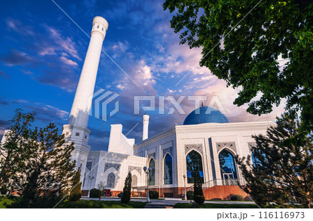 exterior of modern white Islamic Masjid Minor Mosque in Tashkent in Uzbekistan on background of blue sunset sky in summer 116116973
