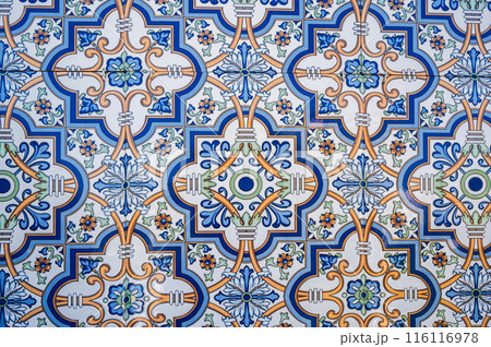 ceramic tile with a traditional Uzbek ornament with a oriental pattern. Wall of white mosque Minor in Uzbekistan ceramic tile with a traditional Uzbek ornament with a oriental pattern. Wall of white mosque Minor in Uzbekistan 116116978