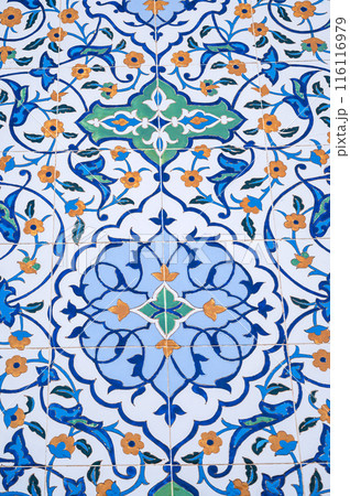 ceramic tile with Uzbek floral ornament with a pattern of flowers. The wall of white mosque Minor in Tashkent in Uzbekistan 116116979