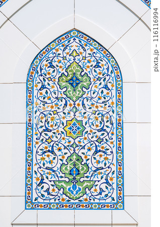 Uzbek ceramic tile decor with oriental patterns and ornaments on marble wall of white Minor Mosque in Tashkent in Uzbekistan Uzbek ceramic tile decor with oriental patterns and ornaments on marble wall of white Minor Mosque in Tashkent in Uzbekistan 116116994
