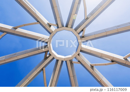 construction of art object on background of blue sky background. Amphitheater in Navruz Park in Tashkent construction of art object on background of blue sky background. Amphitheater in Navruz Park in Tashkent 116117009