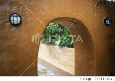 A coffee shop terrace with tables and chairs 116117505