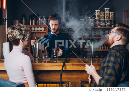 young handsome barmen making tea 116117573