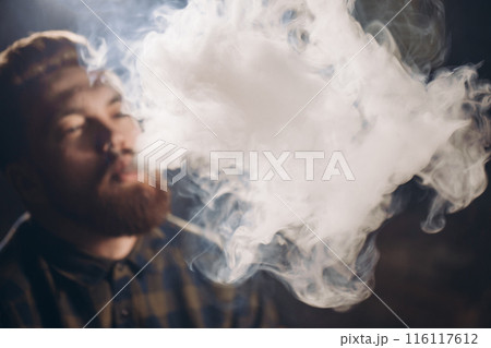 young drug addict into the smoke 116117612