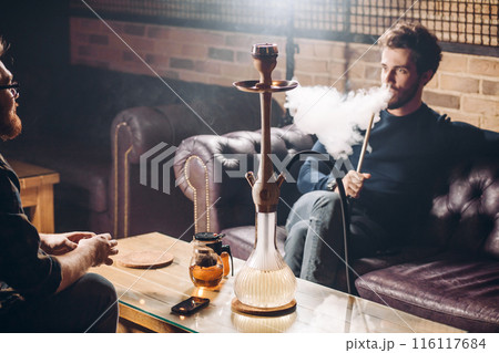 colleagues discussing problems at work at the cafe 116117684