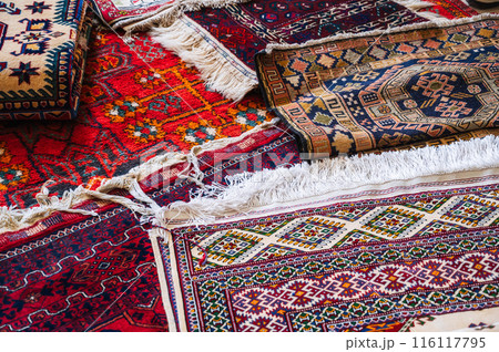 stack of traditional oriental Arab Asian Uzbek handmade colorful carpets at the market in Uzbekistan stack of traditional oriental Arab Asian Uzbek handmade colorful carpets at the market in stack of traditional oriental Arab Asian Uzbek handmade colorful carpets at the market in Uzbekistan stack of traditional oriental Arab Asian Uzbek handmade colorful carpets at the market in 116117795