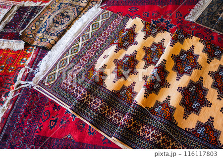 traditional oriental Asian handmade carpets at the market in Uzbekistan 116117803