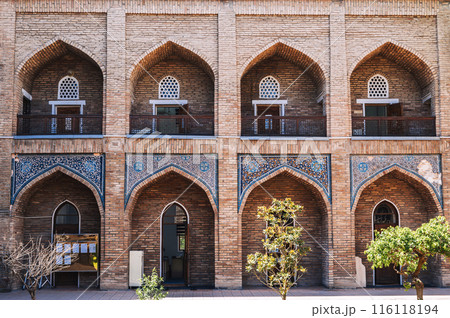 Cells of students in courtyard of ancient educational Islamic madrasah Kukeldash in Tashkent in Uzbekistan 116118194