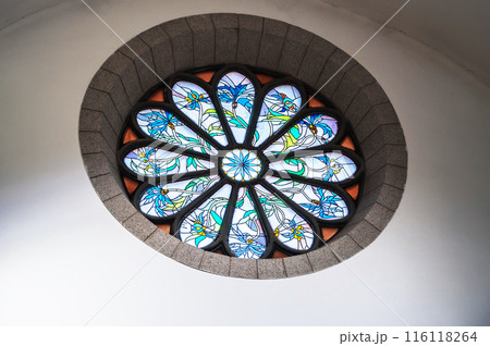 stained glass window decorated with mosaics inside an ancient Christian Roman Catholic church. Sacred Heart of Jesus Cathedral in Tashkent stained glass window decorated with mosaics inside an ancient Christian Roman Catholic church. Sacred Heart of Jesus Cathedral in Tashkent 116118264