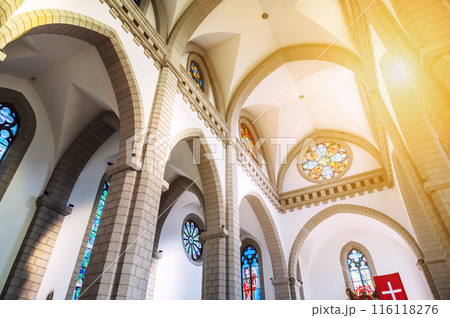 Cathedral of the Sacred Heart of Jesus in Tashkent in Uzbekistan. Interior of an old Christian Catholic church with sunlight through window 116118276